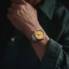 Baume & Mercier Riviera Baumatic orologio da uomo M0A10822, quadrante oro, cinturino in acciaio inossidabile argento